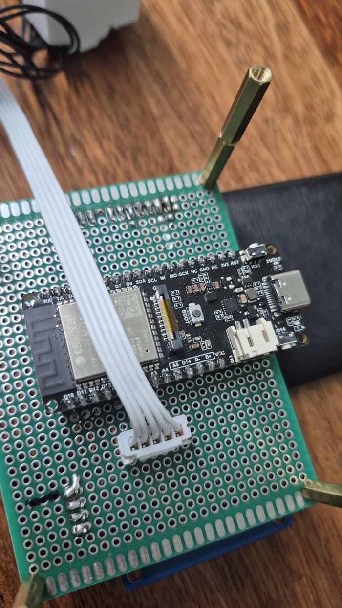 An ESP32-S3 board mounted on a perfboard